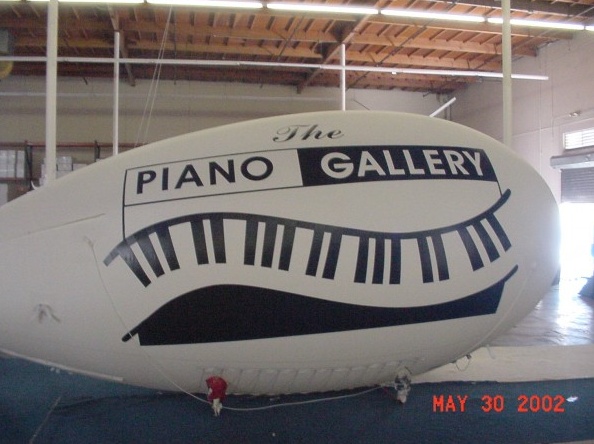 White Black Advertising Piano Gallery Blimp