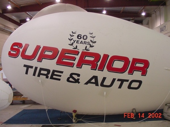 White Red Advertising Superior Tire Auto Blimp